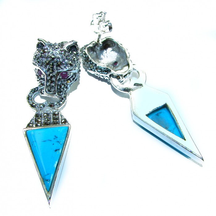 Spectacular Blue Panthers inlay Turquoise .925 Sterling Silver handcrafted Earrings - Earrings with panther heads and turquoise inlay, angled display view.