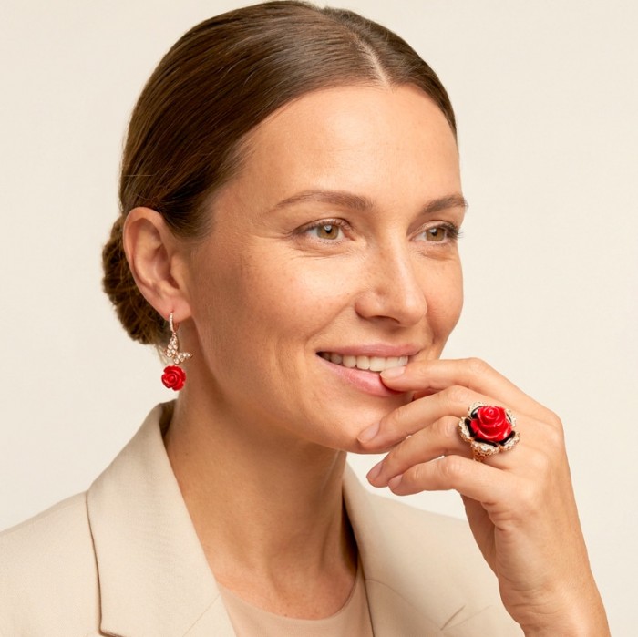 Enchanted Rose Genuine carved Coral 14K Gold over .925 Sterling Silver handcrafted ring s. 7 1/4 - Woman wearing Enchanted Rose jewelry, focus on earring and ring.