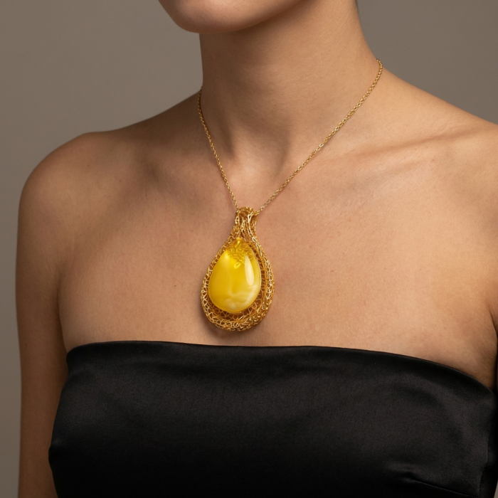 Tiffany Prehistoric Authentic Buttescotch Baltic Amber 22K Gold over .925 Sterling Silver beautifully handcrafted Pendant - Necklace with yellow amber pendant worn on model, front view.