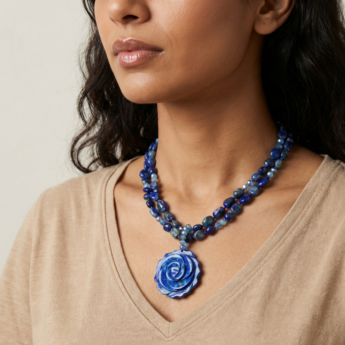 Bohemian style genuine carved Sodalite .925 Sterling Silver Necklace - Close-up of carved Sodalite necklace worn around the neck.