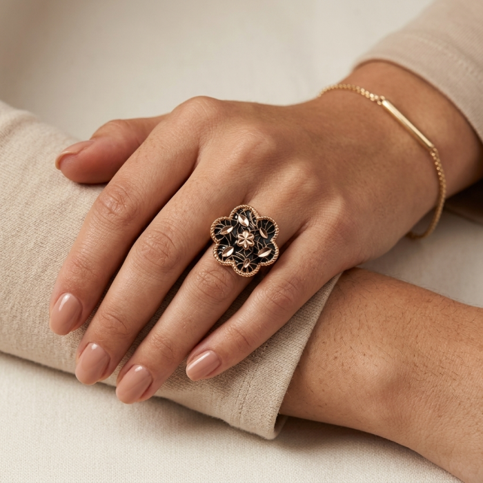 Dubai Style - Golden Flowers black enamel .925 Sterling Silver dipped in 22K Rose Gold handmade Large ring size 6 - Black enamel flower ring on hand, close-up angle showing detail.