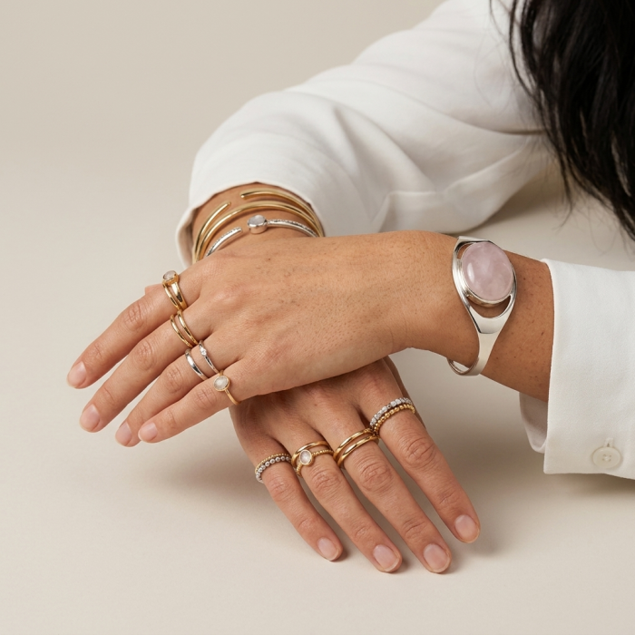 Genuine 51.5 carat Brazilian Rose Quartz .925 Sterling Silver handcrafted Bracelet / Cuff - Hands wearing gold rings and bracelets with rose quartz bracelet in view