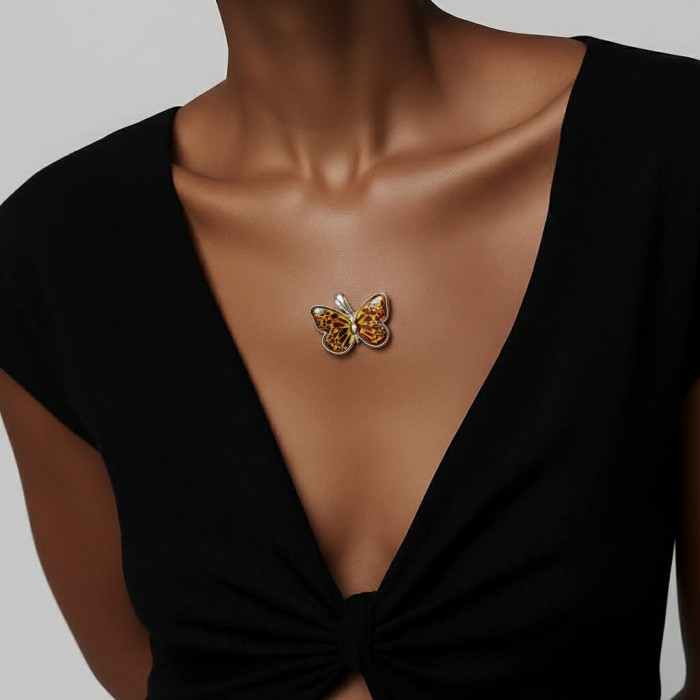 Prehistoric Authentic Butterscotch Baltic Amber .925 Sterling Silver beautifully handcrafted Pendant - Butterfly brooch worn at neckline, amber detailing visible