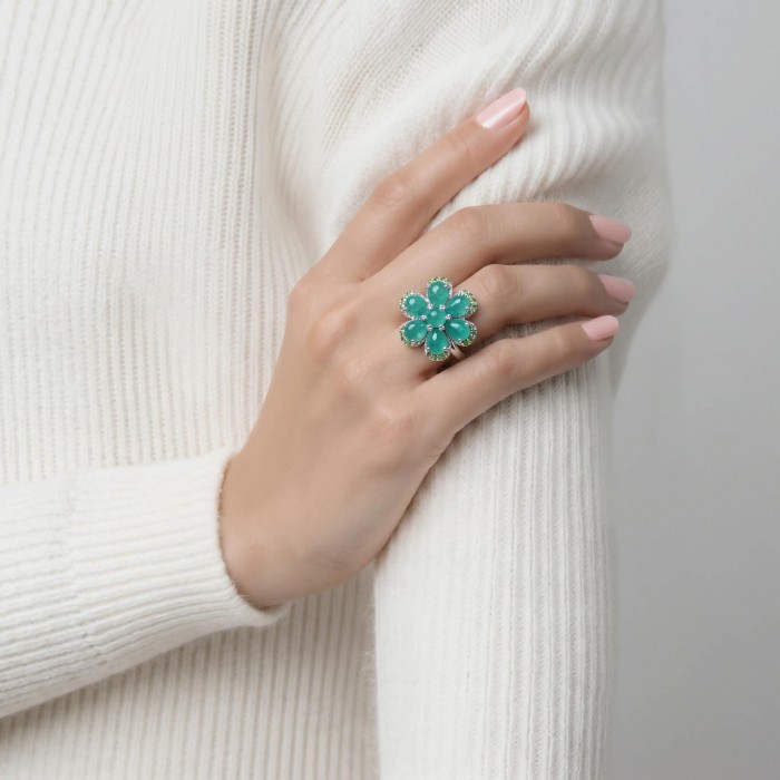 Amazonia - 20.8 carat Colombian Emerald .925 Sterling Silver handmade Statemen .925 Sterling Silver ring size 8 - Emerald ring worn on hand, front view, white sweater background.
