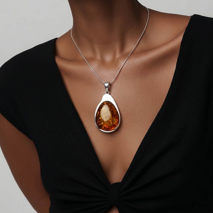 Sea Treasure Prehistoric Authentic Butterscotch Baltic Amber .925 Sterling Silver beautifully handcrafted Pendant - Worn necklace with teardrop butterscotch Baltic amber pendant.