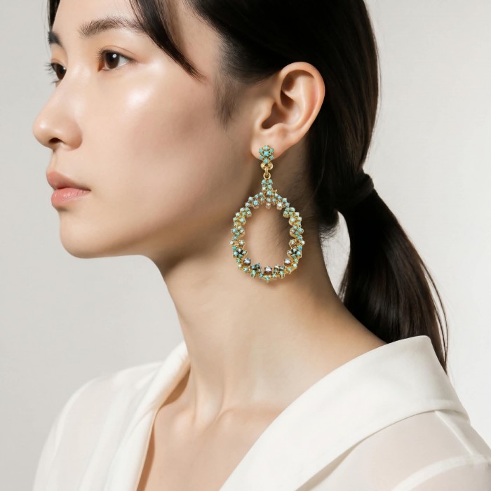 Pure Serenity 8.5 carat genuine Swiss Blue Topaz 18K Gold over .925 Sterling Silver handmade Statement earrings - Side view of Pure Serenity Swiss Blue Topaz earrings worn on ear