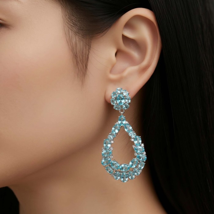 Serenity 18.5 carat genuine Swiss Blue Topaz .925 Sterling Silver handmade Large Statement earrings - Side view of Serenity Swiss Blue Topaz earrings worn on ear.