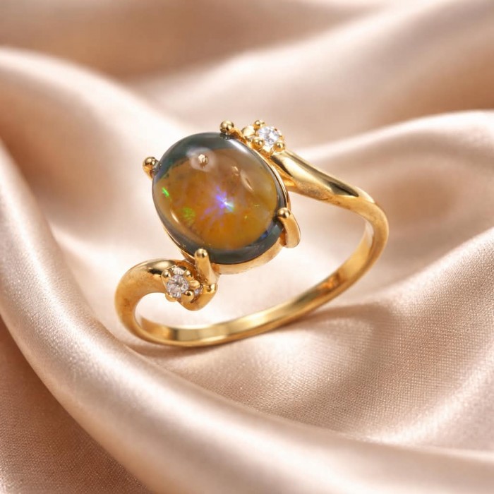 A Milky Way Genuine 4.8 carat Black Opal 18K Gold over .925 Sterling Silver handmade Ring size 7 1/2 - Close-up of Milky Way black opal ring on silk fabric background.