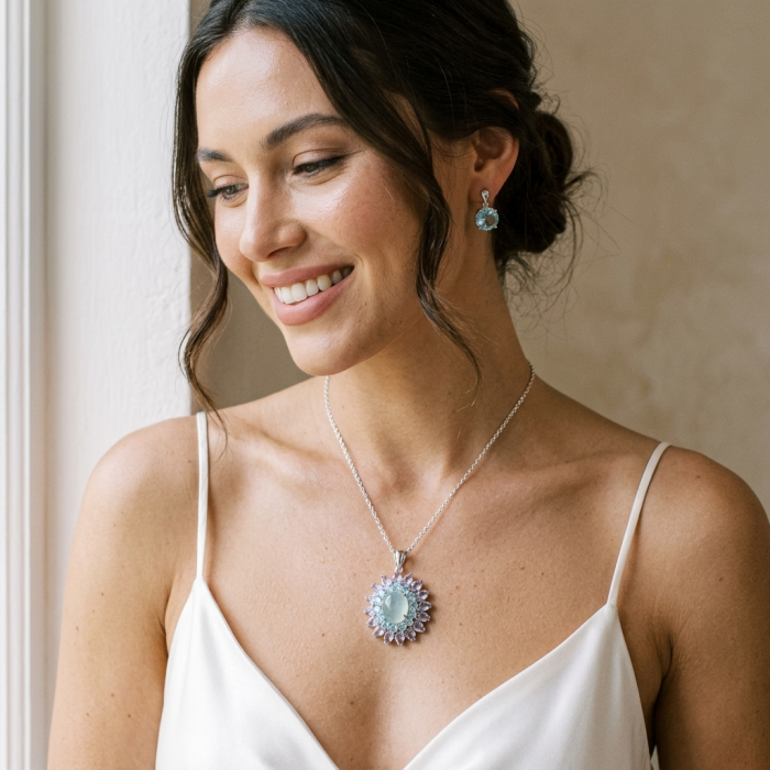 Royal quality genuine 19.8 carat Prehnite rhodium over .925 Sterling Silver handcrafted Pendant - Woman wearing Prehnite necklace and earrings, close-up view