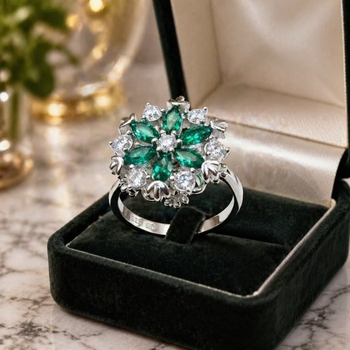 Real 3.2 carat Emerald Italy Made Silver Sterling Silver spinning ring s. 7 1/2 - Emerald and diamond floral ring in open box, front view.