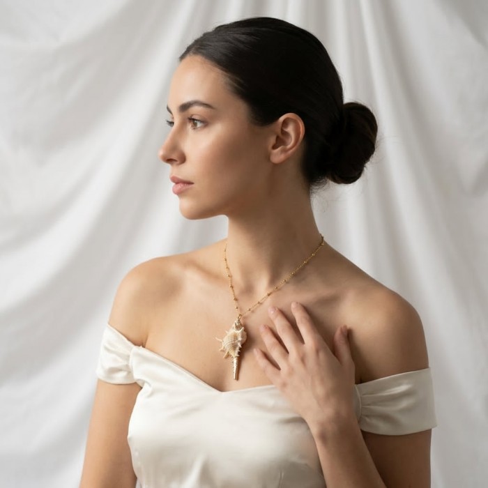 Vitamin Sea Large Oceab Shell 14K Gold over .925 Shell Sterling Silver necklace - Side view of woman wearing Vitamin Sea Large Ocean Shell necklace