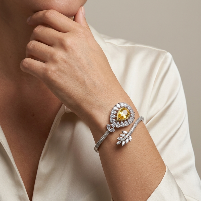 Dolce Vita - Precious Natural 18.5 carat yellow Sapphire .925 Sterling Silver handcrafted LARGE bracelet - Yellow sapphire bracelet worn on wrist, showcased on a person's hand.