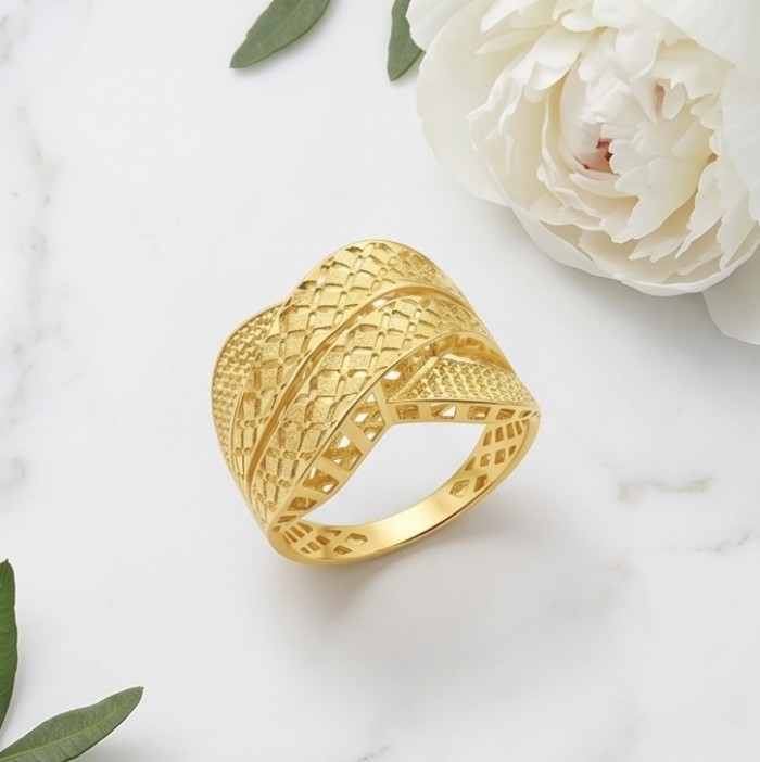 Dubai Style .925 Sterling Silver dipped in 22K Gold handmade Large ring size 9 - Gold-plated ring with textured design, top view with flower backdrop.
