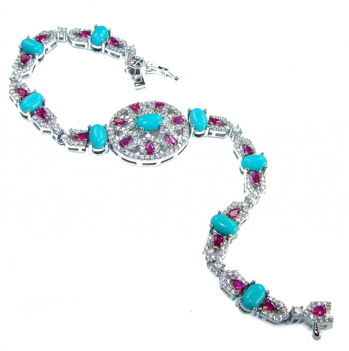 Serenity- 21.5 carat genuine Swiss Blue Turquoise 9.5 carat Ruby .925 Sterling Silver handmade Statement Bracelet - Swiss Blue Turquoise bracelet with rubies, angled full view.