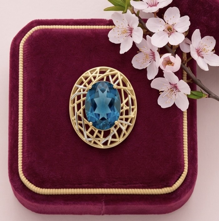 Blue Island - 8.2 carat London Blue Topaz 18K Gold over .925 Sterling Silver handmade Pendant - Blue Topaz pendant on velvet box with cherry blossoms, top view.