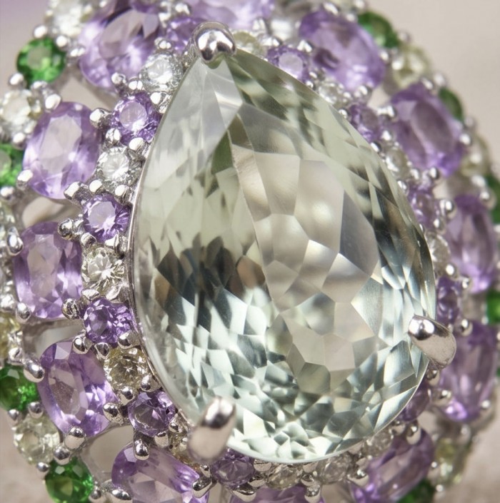 Large Natural 18.5 carat carved Green Amethyst rhodium over .925 Sterling Silver handcrafted ring size 6 3/4 - Close-up of large green amethyst ring with purple and green gemstones.