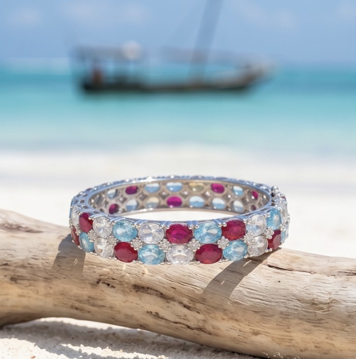 Fiesta Authentic 51.2 carat Morganite Ruby Swiss Blue Topaz .925 Sterling Silver handmade bangle Bracelet - Colorful gemstone ring on driftwood, side view with ocean background
