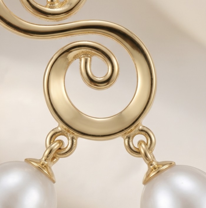 Sublime natural Pearl 18K Gold over .925 Sterling Silver handcrafted Earrings - Close-up of pearl and gold swirl detail on earring.