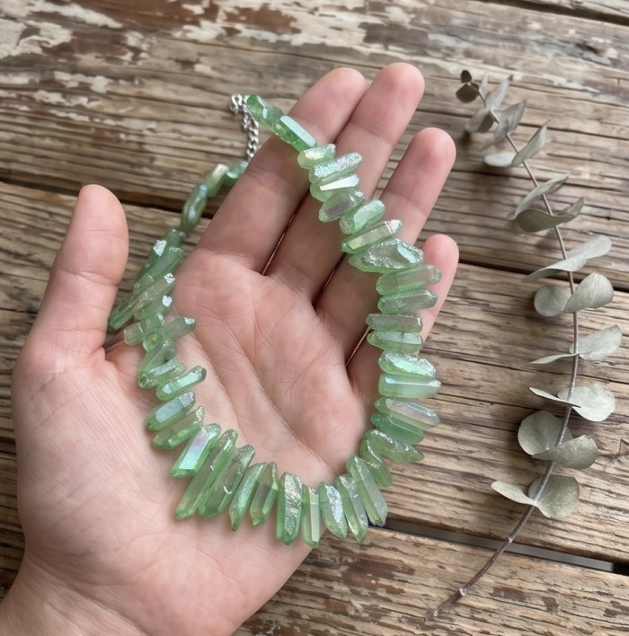 Mint-Green Halite Crystal Cluster .925 Sterling Silver handmade Necklace - Mint-green halite crystal necklace held in hand, wooden background.