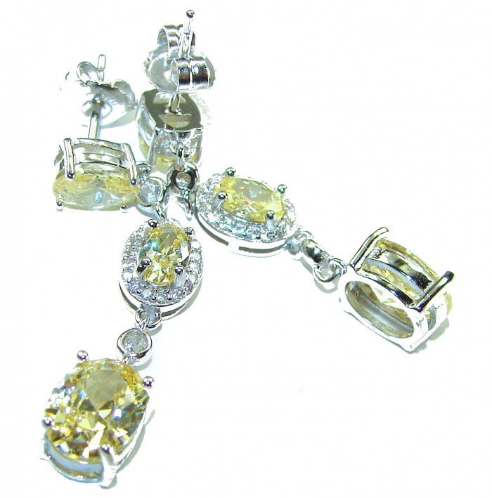 Born in Spain Luxurious Natural 7.2 carat Citrine from Spain .925 Sterling Silver handmade earrings - Close-up of Citrine earrings and pendant set with silver detailing.