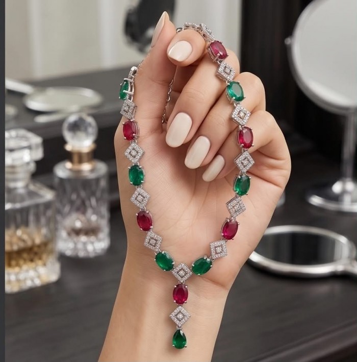 Francesca - Luxurious natural 19.8 carat Ruby Emerald .925 Sterling Silver handmade Statement necklace - Hand holding Francesca necklace with rubies and emeralds, elegant display