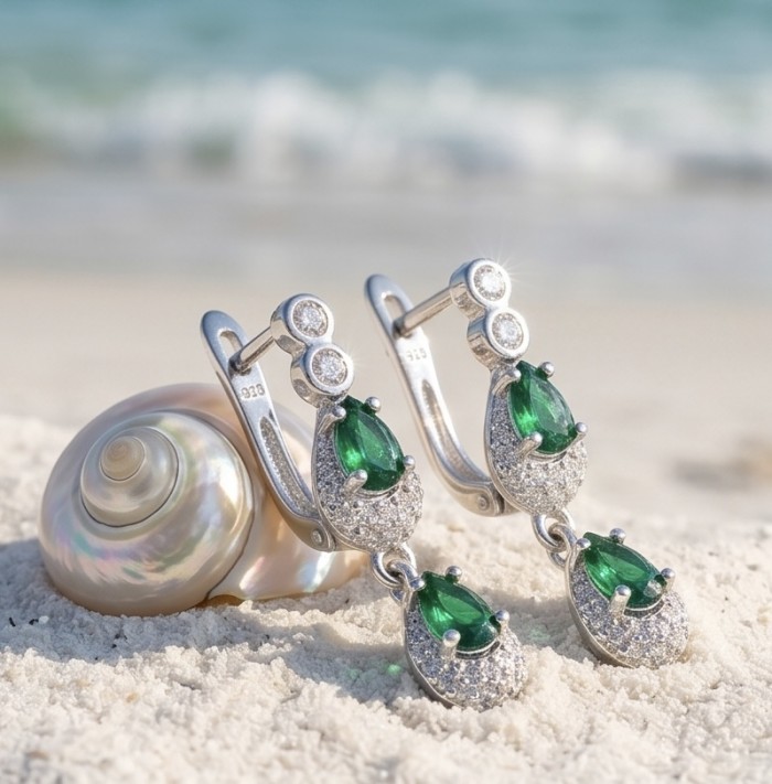 Isabella 2.5 carat emerald cut Colombian Emerald .925 Sterling Silver Perfectly handcrafted earrings - Emerald earrings beach shot with seashell, side view