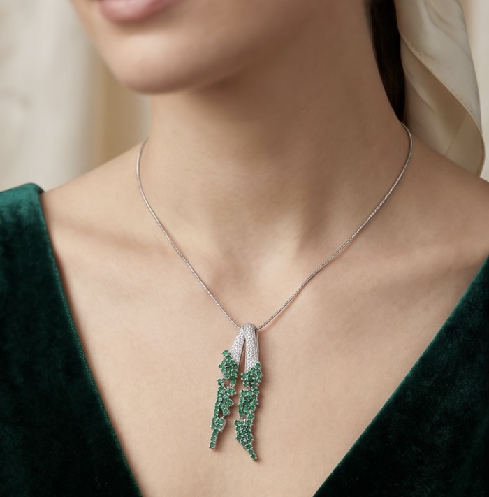 Heirloom Genuine 10.5 carat Colombian Emerald .925 Sterling Silver dipped in rhodium handmade Pendant - Necklace with emerald pendant worn around neck, close-up front view.