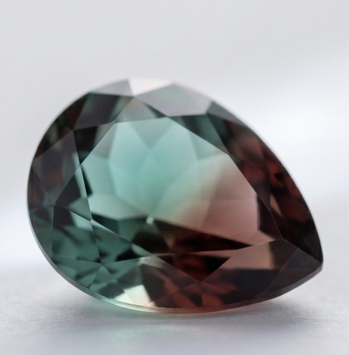 From dawn to dusk authentic 11.2 carat Brazilian Smoky Topaz .925 Sterling Silver handcrafted earrings - Close-up of pear-shaped Brazilian smoky topaz gemstone.