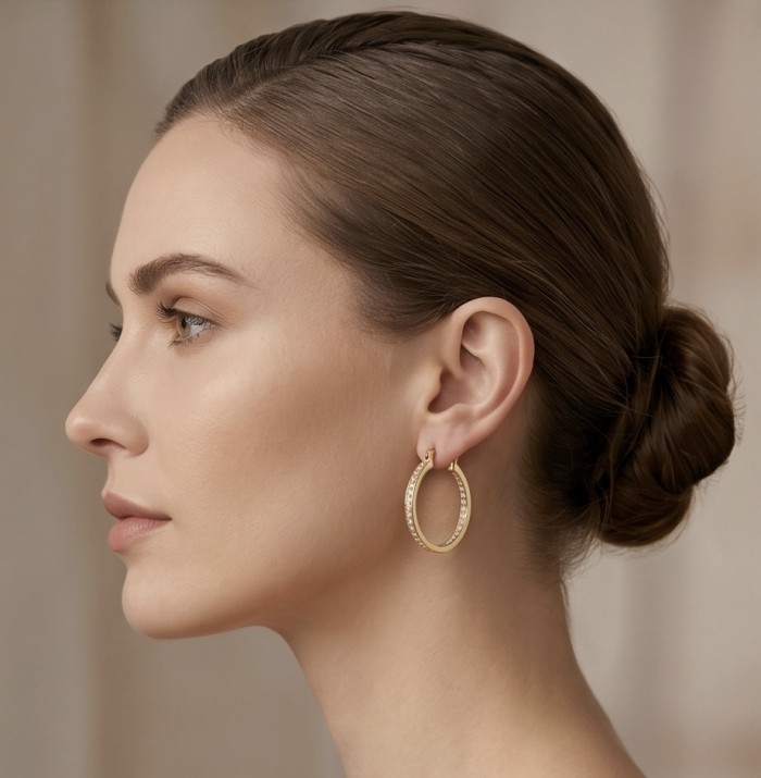 Dubai Style - .925 Sterling Silver dipped in 22K Gold handmade Large Earrings - Side view of woman wearing gold hoop earring.