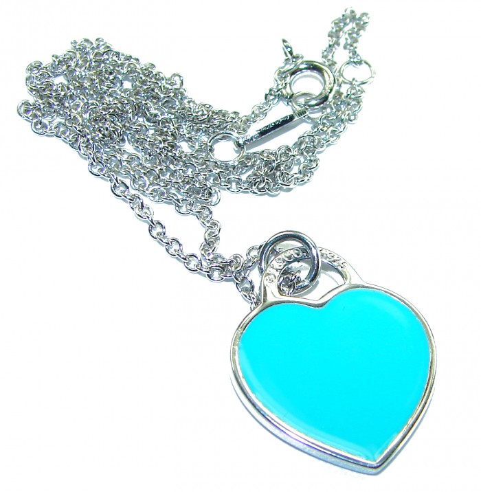 Angel's Heart inlay Turquoise .925 Sterling Silver handcrafted necklace - Heart-shaped turquoise pendant on a silver chain, overhead view.