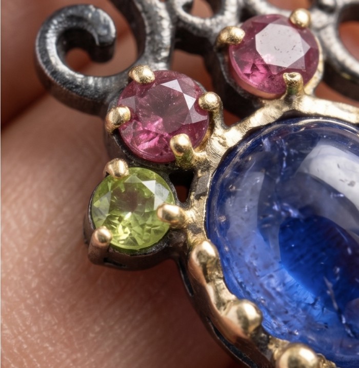 Summer Fiesta 9.5 carat natural Tanzanite black rhodium over .925 Sterling Silver Handcrafted Pendant - Close-up of gemstones in Summer Fiesta Tanzanite jewelry piece.