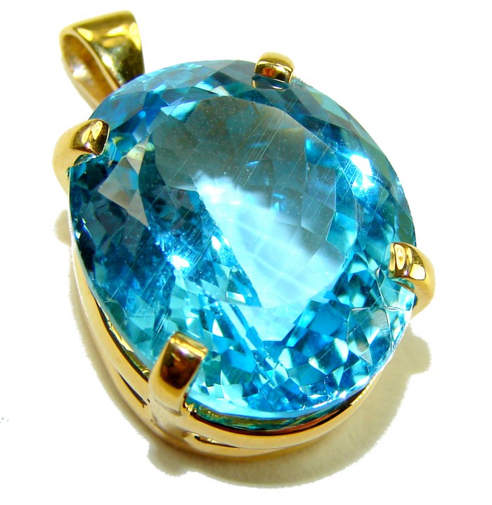 Atlantica oval cut 18.9 carat Swiss Blue Topaz 18K Gold over .925 Sterling Silver Handcrafted Pendant - Close-up of Atlantica Swiss Blue Topaz pendant in gold setting