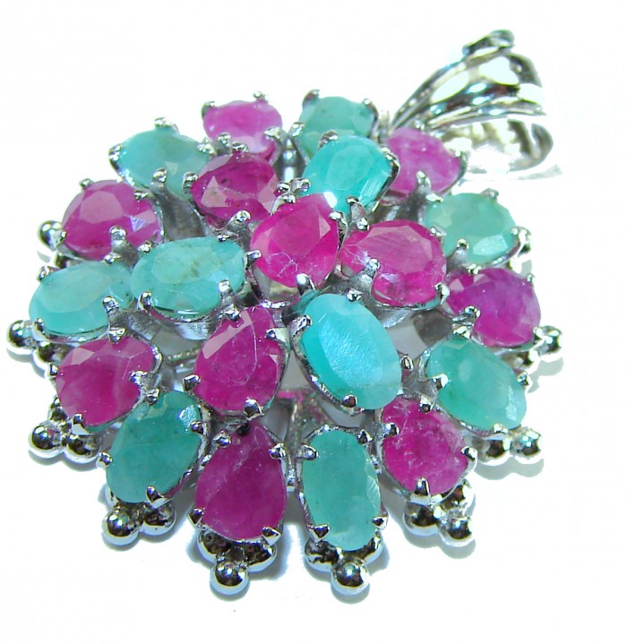 Circle of Life 22.2 carat authentic Ruby Emerald .925 Sterling Silver handmade Pendant - Close-up of a vibrant ruby and emerald pendant in silver setting.