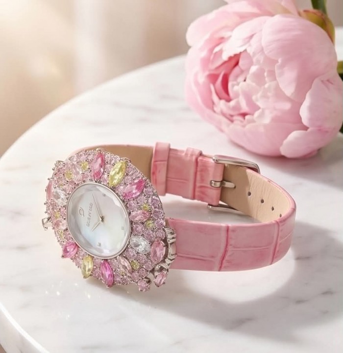 Precious 18.5 carat Authentic Pink Sapphire Genuine Leather strap .925 Sterling Silver handmade Watch - Pink sapphire watch on marble table beside pink flower, top view.