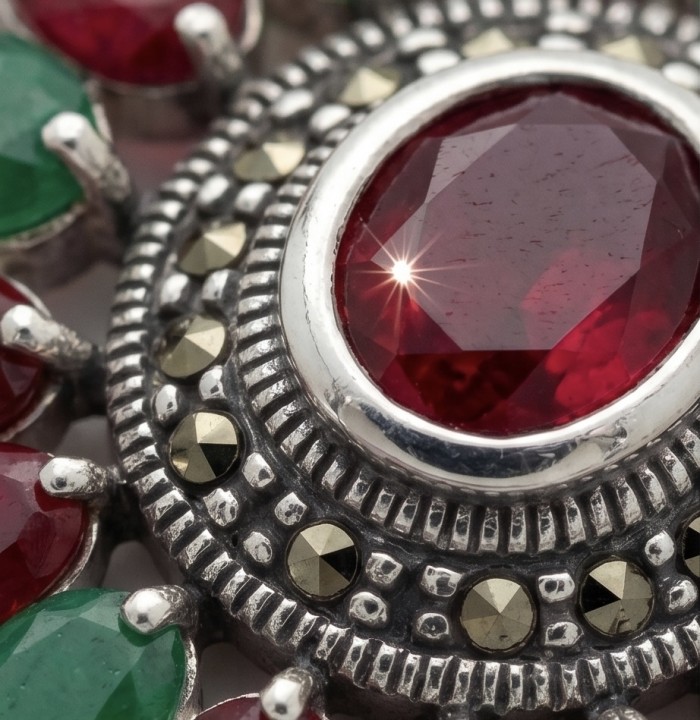 Giovanna 22.2 carat authentic Ruby Emerald Marcasite .925 Sterling Silver handmade Pendant - Close-up of ruby and emerald with marcasite accents in jewelry.