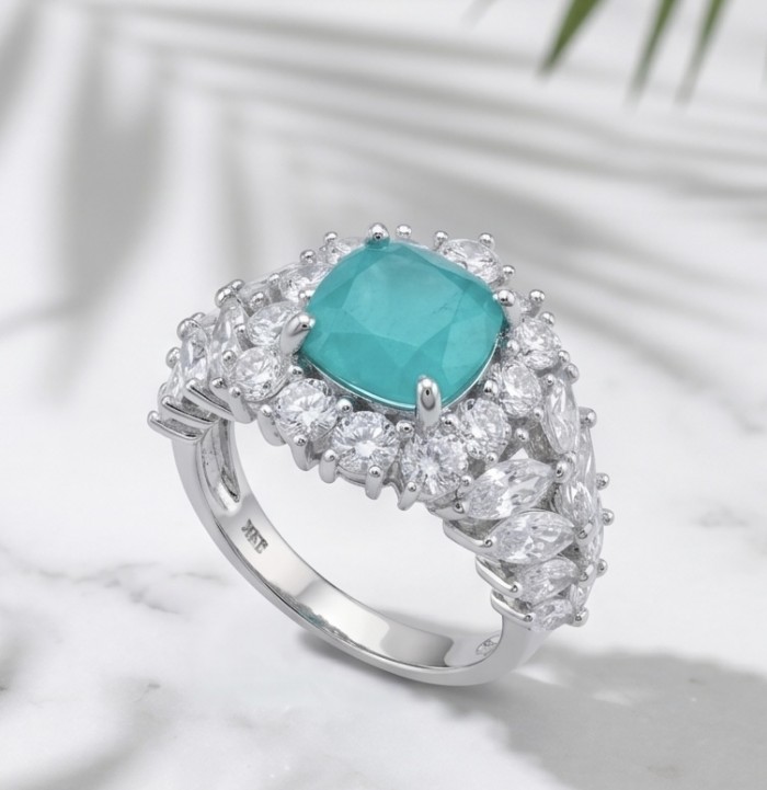 5.4 carat natural Colombian Emerald 8.9 carat Moissanite .925 Sterling Silver handmade Statement Ring size 7 1/2 - Emerald ring with moissanite stones on marble background, angled view