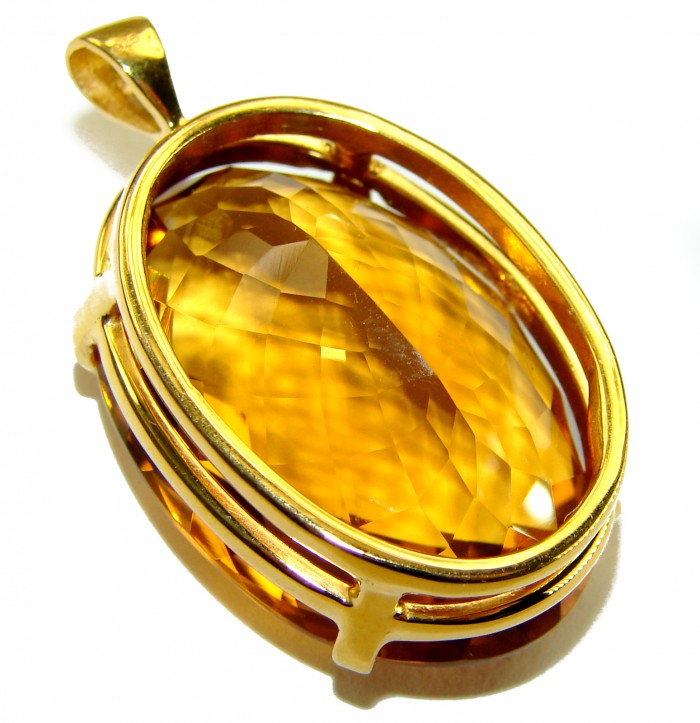Luxury genuine 37.9 CARAT oval cut Champagne Topaz .925 Sterling Silver dipped in 22K Gold handmade Pendant - Close-up of luxury oval cut Champagne Topaz pendant in gold setting.