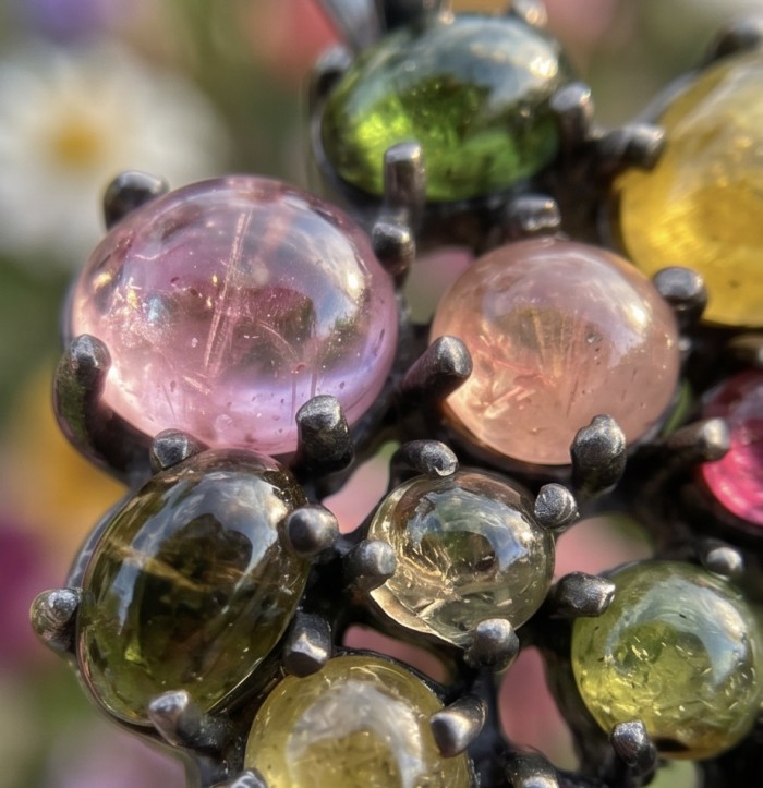 Victoria 25.5 carat Brazilian Watermalon Tourmaline black rhodium over .925 Sterling Silver handmade Pendant - Close-up of multicolored gemstones in black metal prong setting.