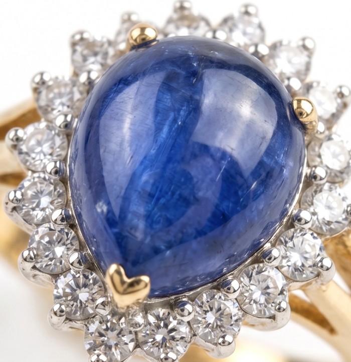 Precious Design pear cut 19.5 CARAT Tanzanite 22K Gold over .925 Sterling Silver Statement Ring s. 7 - Close-up of pear cut Tanzanite ring with diamond halo and gold accents.