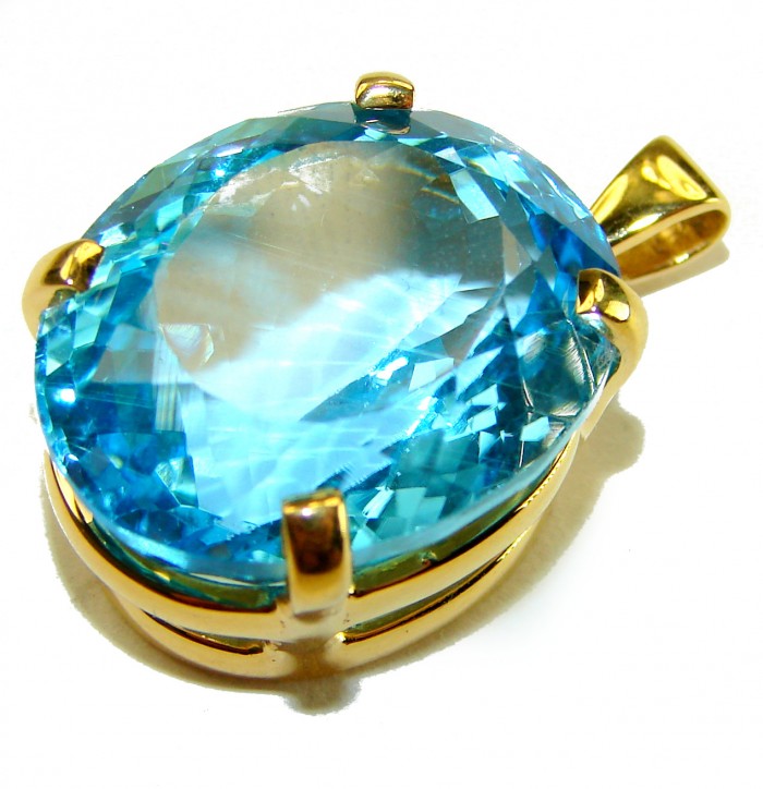 Atlantica oval cut 18.9 carat Swiss Blue Topaz 18K Gold over .925 Sterling Silver Handcrafted Pendant - Close-up of 18.9 carat Swiss Blue Topaz pendant in 18K gold setting.