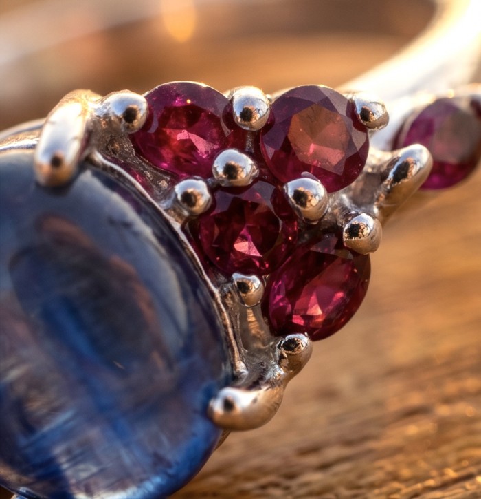 Luxurious 4.5 ctw Tanzanite .925 Sterling Silver handcrafted Statement Ring size 8 - Close-up of Tanzanite and Ruby accents on a sterling silver ring.