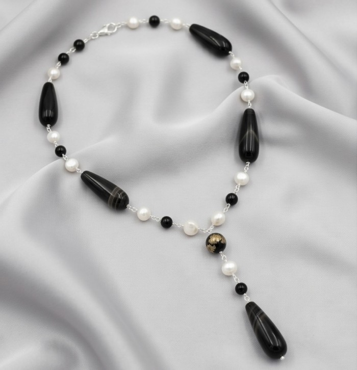 Black and White 26 inches authentic Onyx Pearl .925 Sterling Silver handmade Station Necklace - Black and white onyx pearl necklace on a draped fabric background.