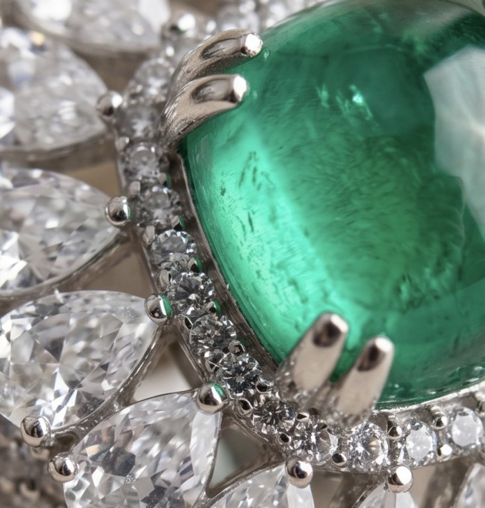 Elizabeth princess cut 4.8 carat Colombian Emerald 8.3 carat Moissanite .925 Sterling Silver dipped in Rhodium handcrafted Ring size 5 1/4 - Close-up of Colombian emerald with diamond accents in a jeweled setting.