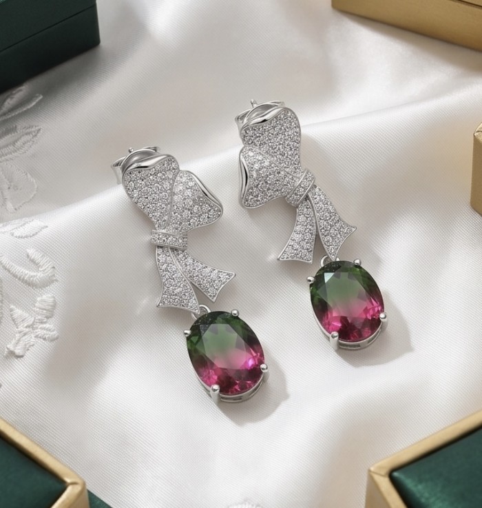 Luxurious 4.9 carat Brazilian Watermelon Tourmaline .925 Sterling Silver Handcrafted Earrings - Elegant earrings with watermelon tourmaline and bow design, side view.