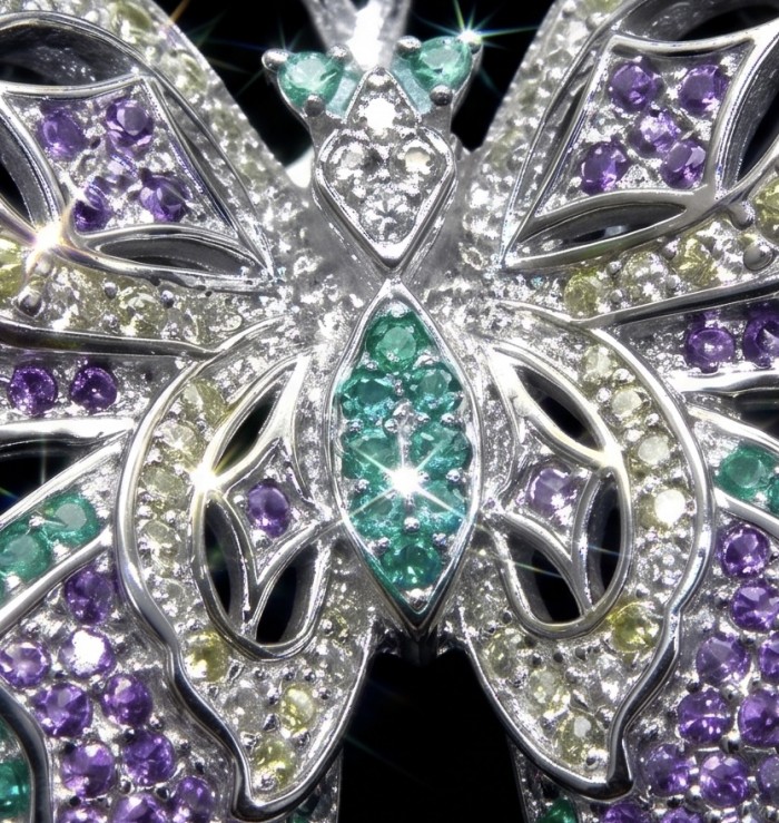 Vintage Design - Green Butterfly - Genuine 3.2 carat Colombian Emerald .925 Sterling Silver handmade Pendant Brooch - Close-up of vintage butterfly jewelry with colorful gemstones.