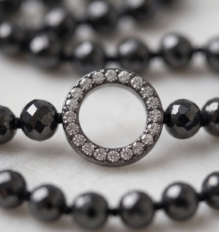 Boho Style Genuine Titanum Crystal .925 Sterling Silver handmade necklace 34 inches long - Close-up of a titanium crystal necklace with sterling silver circle clasp.