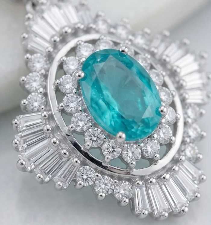 Pure Luxury 6.2 carat natural Colombian Emerald .925 Sterling Silver handmade Statement earrings - Close-up of oval emerald ring with diamond halo in silver setting.