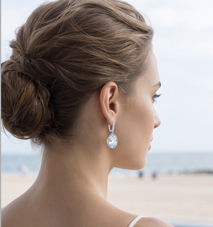 Angelina 14.9 carat authentic White Topaz .925 Sterling Silver Handcrafted Earrings - Side view of White Topaz earrings worn, highlighting the stone's sparkle.