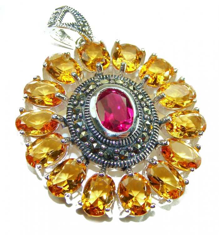Deluxe 10.2 carat Ruby .925 Sterling Silver handmade Pendant - Detailed view of ruby and amber stones in sterling silver pendant.