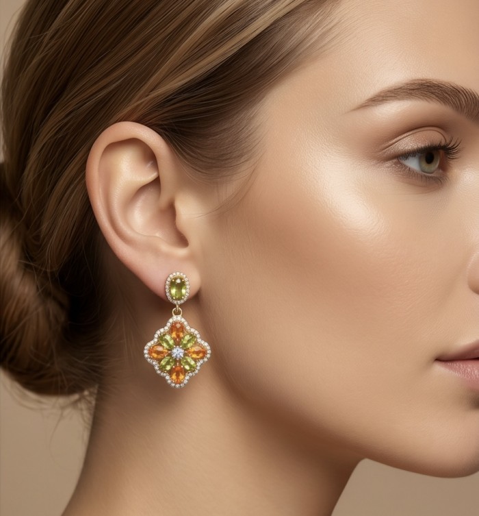 Giovanna - Genuine 4.6 carat orange Sapphire 22K Gold over .925 Sterling Silver handcrafted Statement Earrings - Side view of woman wearing Giovanna 4.6 carat orange sapphire earrings.